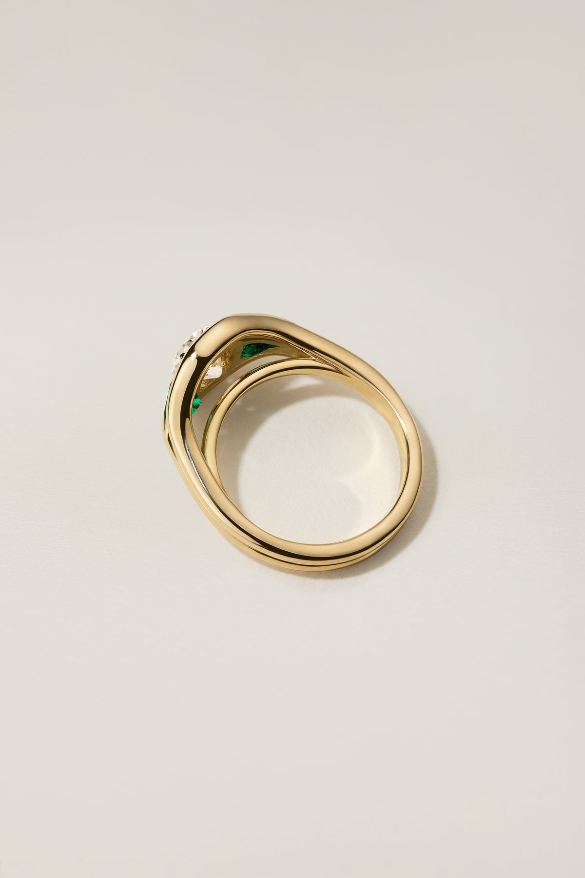 Emmy Ring from the side, showing the double-wire gold shank wrapping the finger