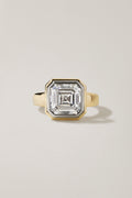 Kata Ring, a 5.01 carat asscher cut diamond in a platinum bezel with a stepped 18k yellow gold surround