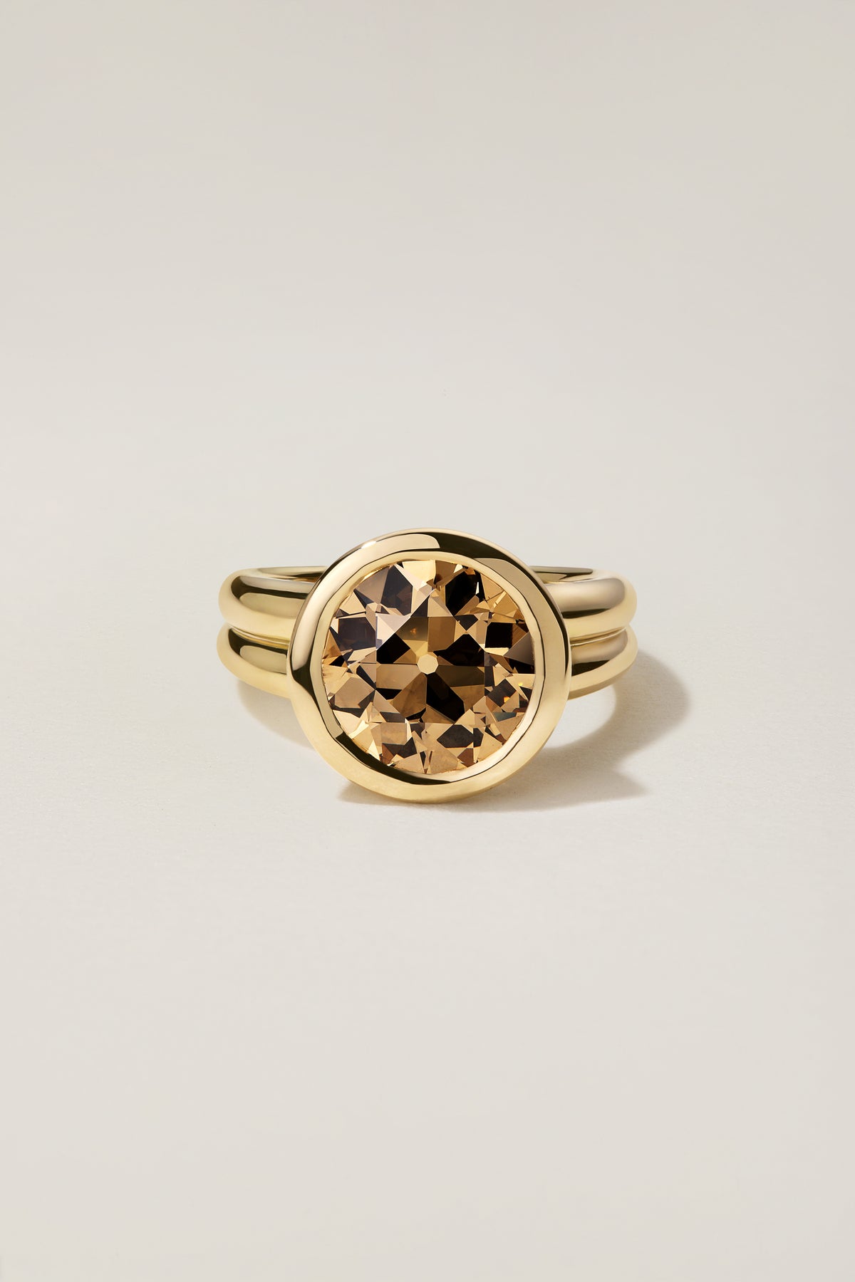 Leona 4.30, a 4.30 carat fancy yellow-brown old European cut diamond bezel set in 18k yellow gold