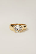 Madeleine Ring, a 2.30 carat old European cut diamond half-bezel set in a wide 18k yellow gold band