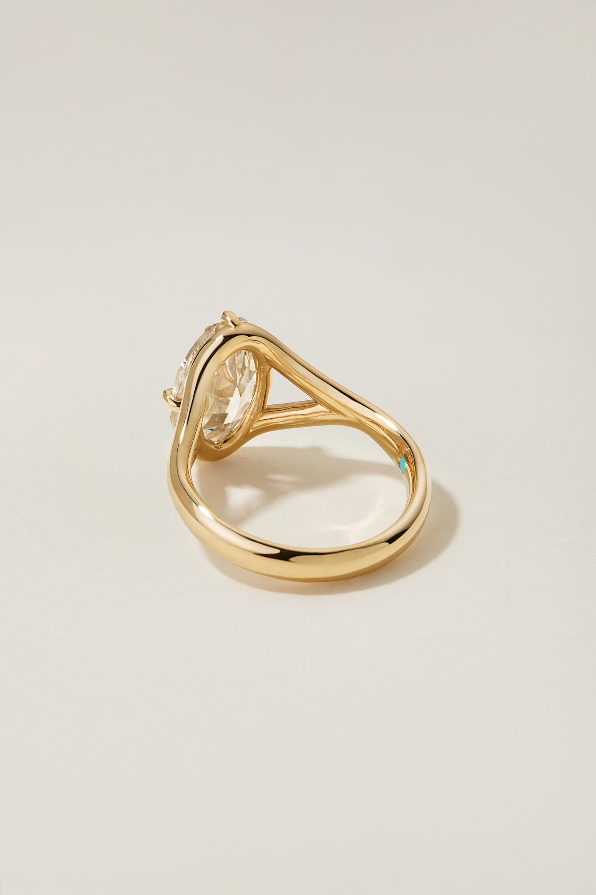 Mosie Ring at an angle, showing its low profile and the negative space of the split shank